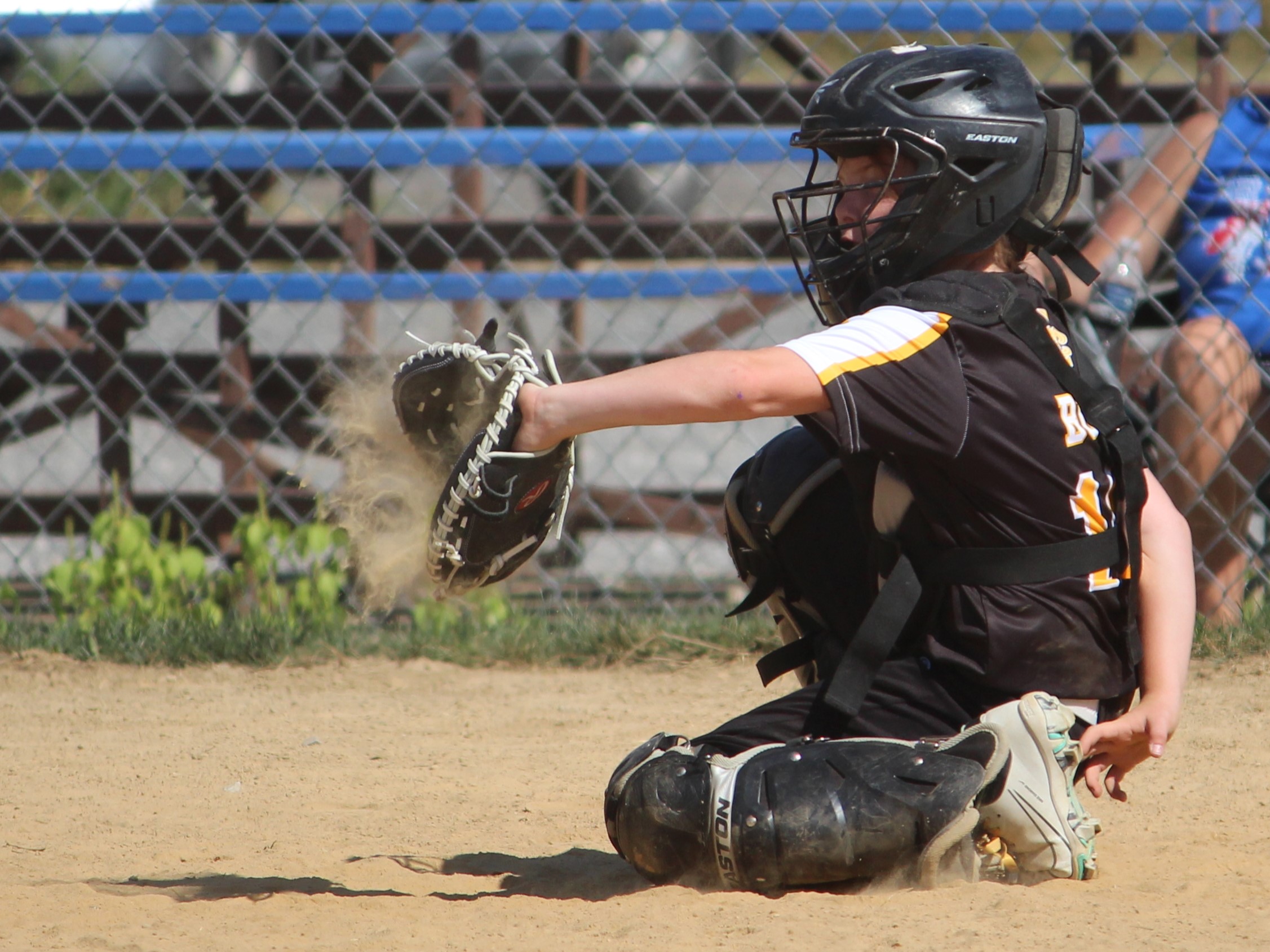 softball catcher catching a ball